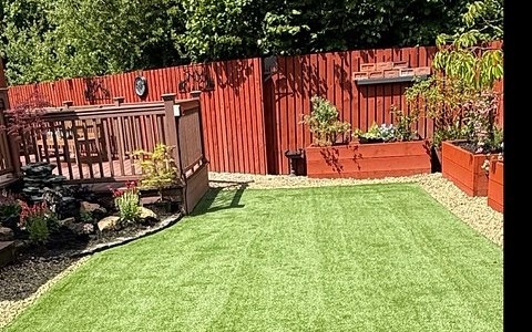 Clean, vibrant artificial lawn after restoration